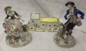 Two Sitzendorf porcelain figures, one of a lady seated with a dog and a lamb at her feet, the