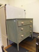 A modern green painted chest of three long drawers