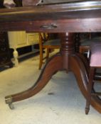 A 19th century and later rectangular mahogany breakfast table on quadruped base to brass caps and