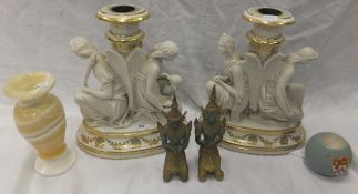 A pair of late 19th / early 20th Century parian ware candlesticks / tazza bases, depicting two