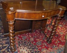 A late 19th Century mahogany hall table, the shaped top on barley-twist front supports united by