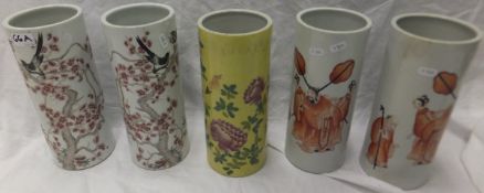 A collection of five Chinese porcelain cylindrical vases, to include a pair decorated with bird