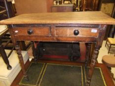 A 19th Century stained pine side table with two frieze drawers, on turned and ringed legs,
