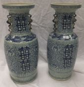 A pair of large Chinese porcelain marriage vases with dog of fo decoration to neck