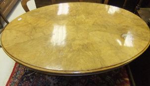 A Victorian burr elm oval snap top breakfast table, the radiated and geometric design with moulded