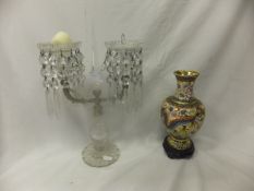 A glass two branch candelabra with glass drops, together with a modern Chinese gilt decorated vase