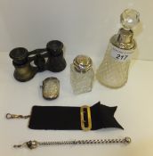 Two silver mounted dressing table bottles, together with a silver vesta case, a cocktail stick and a