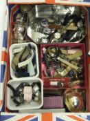 A box containing various lady's and gentleman's wrist watches, together with a lighter in the form