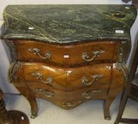A reproduction walnut bombe marble top chest of three drawers in the Louis XV taste