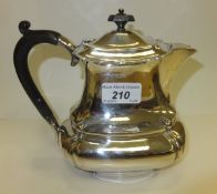 An Edwardian silver hot water jug (by P. Ashbury & Son, Sheffield, 1909)