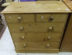 A 19th Century pine chest of two short and three long drawers on a plinth base