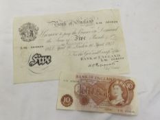 A Bank of England white five pound note, together with a Bank of England ten shilling note