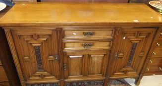 A late 19th Century mahogany sideboard, the rectangular top above two short drawers over a