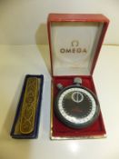 A mid 20th Century Omega stopwatch in case, together with a gilt metal and enamelled penknife, the