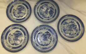 A collection of five similarly decorated 19th Century Chinese porcelain plates decorated in