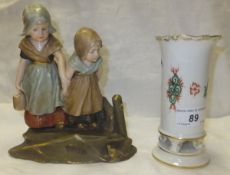 An Ernst Wahliss, Turn, Vienna porcelain figure group of two children wearing clogs and