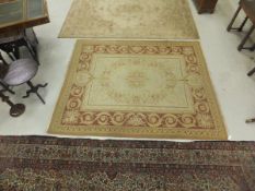An Aubusson style flat woven carpet, the central cream ground with floral decoration in