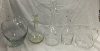 Two clear glass decanters marked "William Yeoward", a Dartington clear glass jug, another