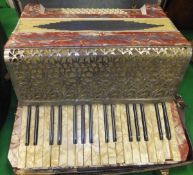 A Scarlatti accordion with red mother of pearl effect decoration, housed in a black carrying case