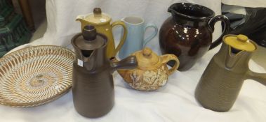 A collection of studio pottery wares and ceramics to include a large jug with incised decoration,