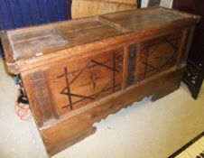 An 18th Century pine coffer, the top with two plain panels over two marquetry inlaid panelled