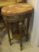 A 19th Century French gilt decorated marble topped occasional table raised on turned spiral
