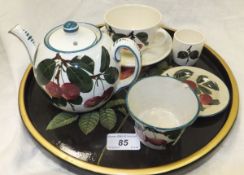 A Wemyss "Cherry" pattern bullet shaped teapot (bearing green painted "Wemyss" to base), saucer (