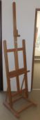 A modern stained beech artist's adjustable easel