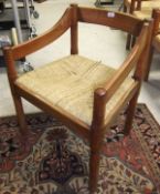A set of six modern stained beech framed carver chairs with rush seats