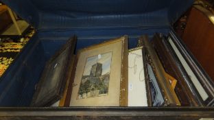 A tin trunk and contents of assorted pictures, prints and framed and glazed black and white