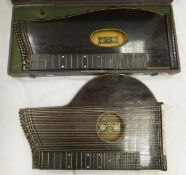 An Anton Kiendl, Wien, guitar zither, housed in a black carrying case, together with another Anton