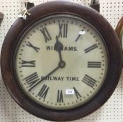 An oak cased railway wall dial by Williams, with Roman numerals and fusee mechanism, the face