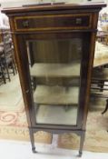 An Edwardian mahogany and inlaid display cabinet the single drawer above a single glazed door raised