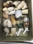 A box containing various clay pipe bowls and a meerschaum bowl, etc