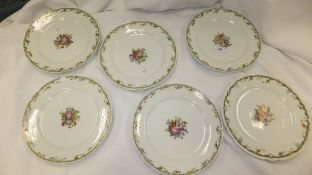 A set of six Continental porcelain plates painted with floral sprays, inscribed to bases "Rousseau