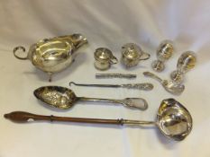 A collection of silver items to include a silver cream jug by Asprey's (Birmingham, 1914), a