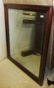 A modern mahogany swept framed wall mirror with Vauxhall style bevel edged plate