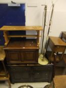 An Ercol dark elm sideboard with plate rack above two drawers and two cupboard doors, a set of six