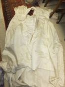 A mid 20th Century cream silk wedding dress, together with a similar bridesmaid's dress, a lace