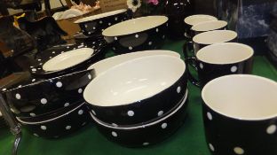 A collection of Spode "Baking Days" pattern dinner wares, decorated in black with white spots,