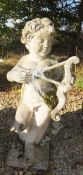 A reconstituted stone garden statue in the form of a cherub