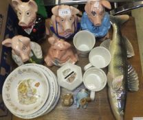 A collection of five Wade pottery Nat West piggy banks, a Beswick pottery Beatrix Potter "Peter