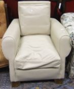 WITHDRAWN A 1920's cream leather upholstered armchair