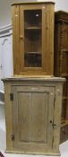 A 19th Century pine corner cupboard with single panelled door and a further modern pine corner