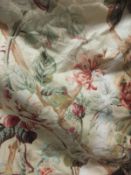 A pair of glazed cotton interlined curtains, the cream ground with pink and green floral sprays,