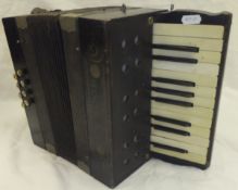 A "Genuine Piano Action" accordion, housed in an associated black plastic box