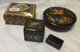 Three lacquered boxes to include two signed Russian examples, together with a small 19th Century