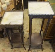 A similar graduated pair of square stands, the square marble top with brass gallery rail on reeded