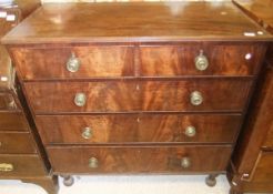 A 19th Century mahogany chest of two short and three long drawers on turned legs