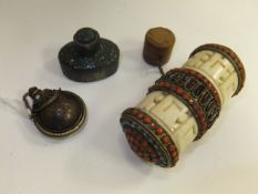 A Tibetan prayer wheel of carved hardstone decorated with coral and turquoise, a turquoise set scent